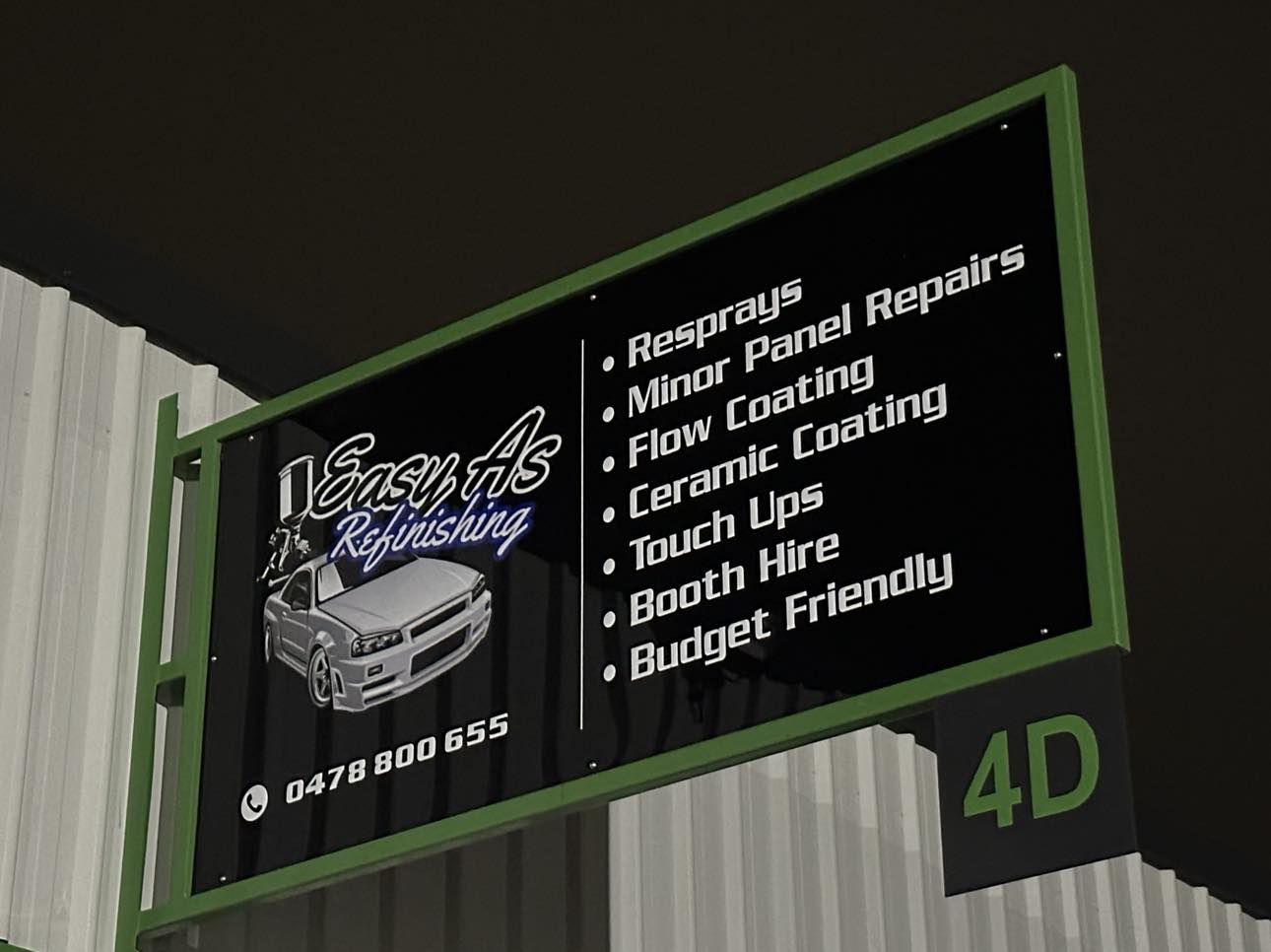 The Easy As Refinishing sign at Shed 4D listing resprays, minor panel repairs, flow coating, ceramic coating, touch ups and booth hire
